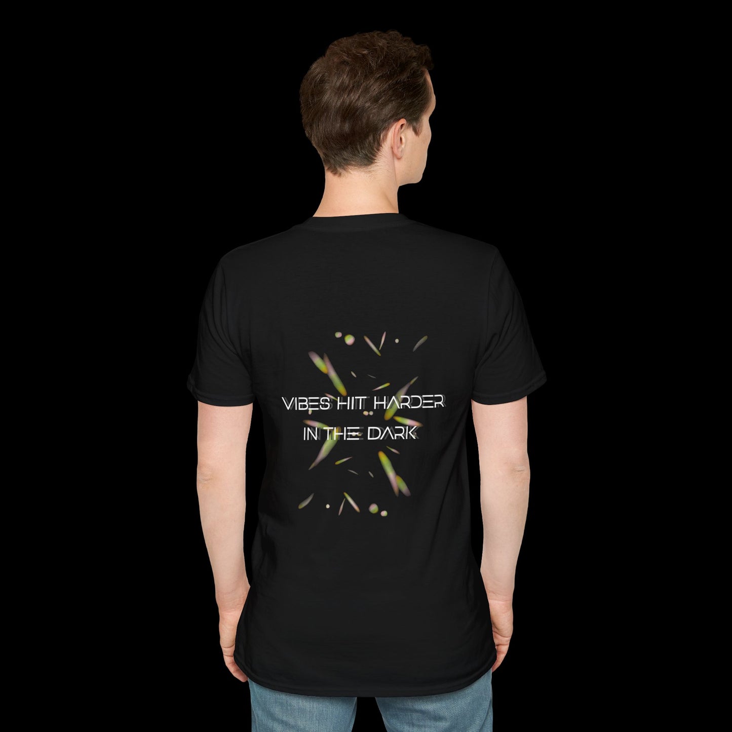 Black t-shirt with glowing abstract elements and “Vibes Hit Harder in the Dark” text in futuristic font. Designed for rave and club wear.