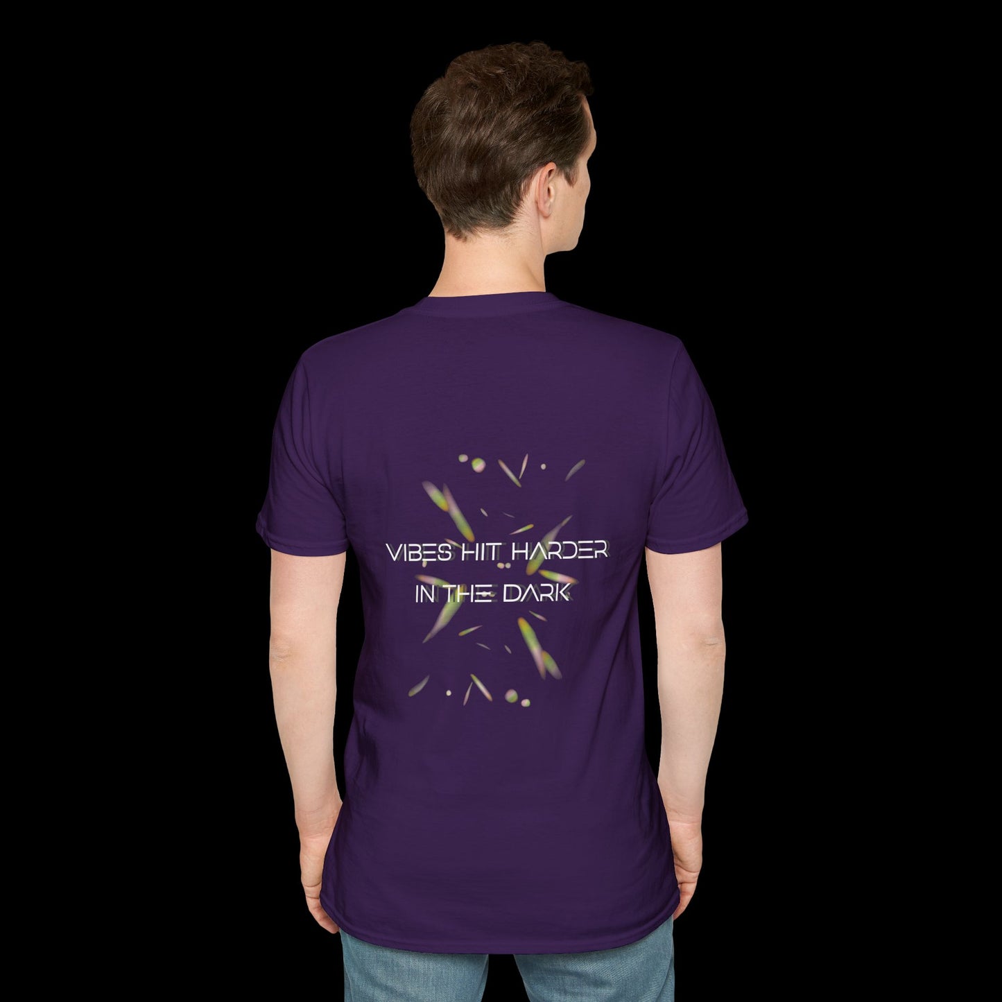 Purple t-shirt with glowing abstract elements and “Vibes Hit Harder in the Dark” text in futuristic font. Designed for rave and club wear.