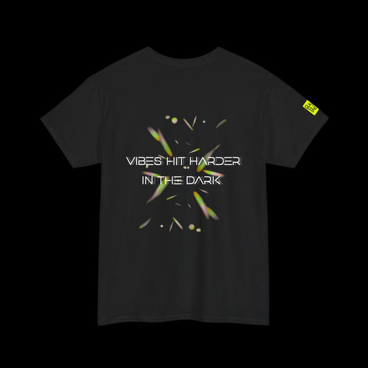 Black t-shirt with text 'Vibes Hit Harder In The Dark' on a dark background