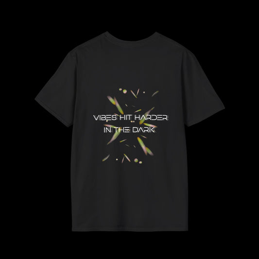 Black t-shirt with glowing abstract elements and “Vibes Hit Harder in the Dark” text in futuristic font. Designed for rave and club wear.