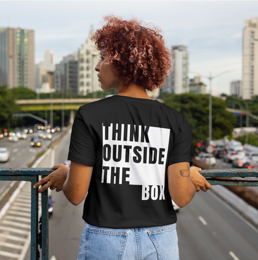 Black T-shirt with the text ‘Think Outside the Box’ in bold white typography