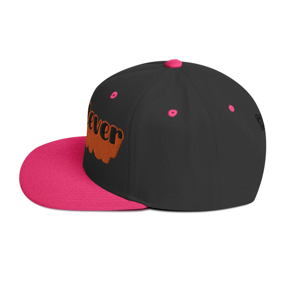 "Whatever" Snapback Hat in pink with bold orange embroidered text, perfect for streetwear fashion.