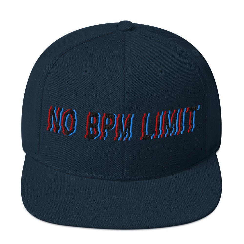 Navy snapback cap with bold glitch-style "No BPM Limit" embroidery in red and blue, designed for electronic music fans and streetwear enthusiasts.t mockup