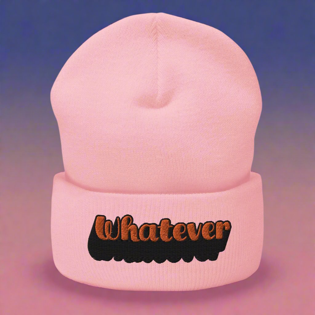 Light pink beanie with 'Whatever' text embroidered in orange and black, trendy typography streetwear accessory.