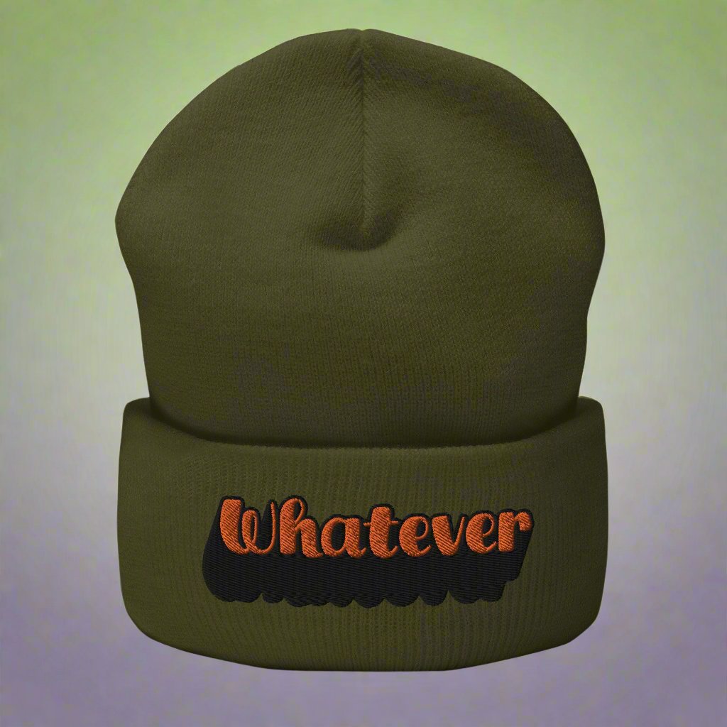 Olive beanie with 'Whatever' text embroidered in orange and black, trendy typography streetwear accessory.